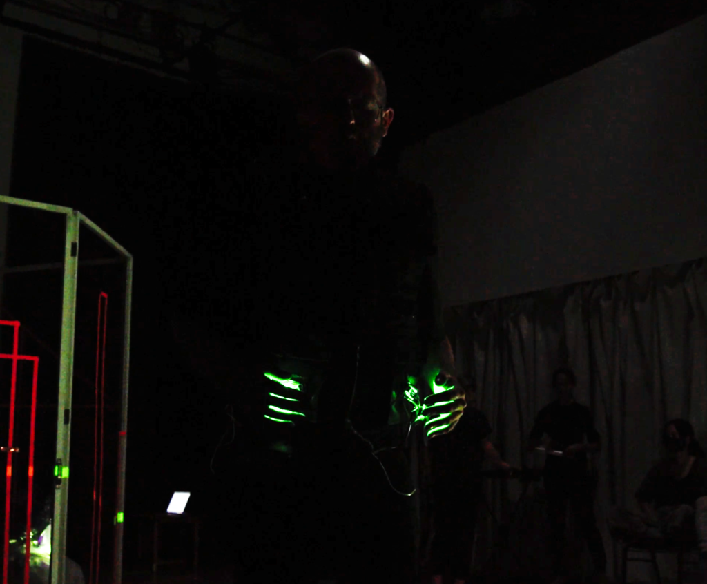 Two-Voiced Gesture-Controlled Electrolarynx vest in performance